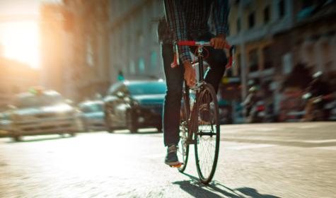 A cyclist riding on the  Gran Via in the center of Madrid.